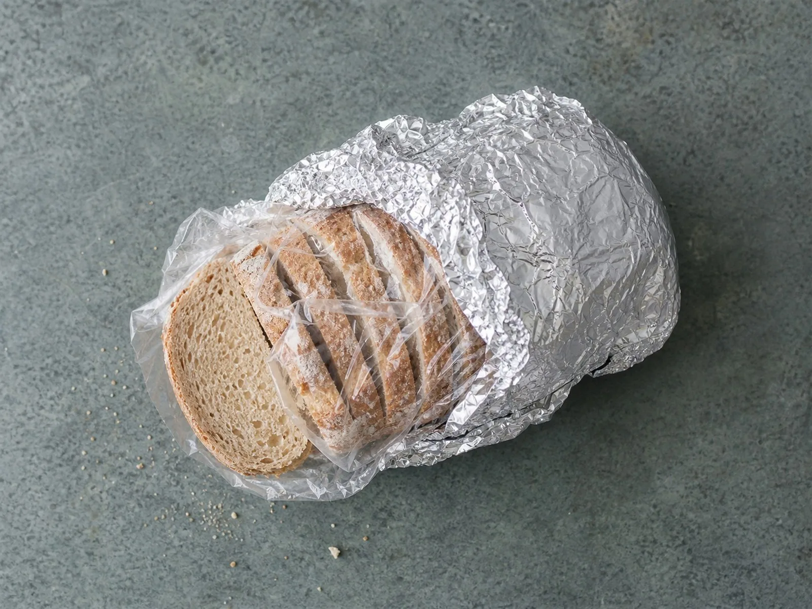 Sliced bread double-wrapped in plastic and foil, ready for the freezer